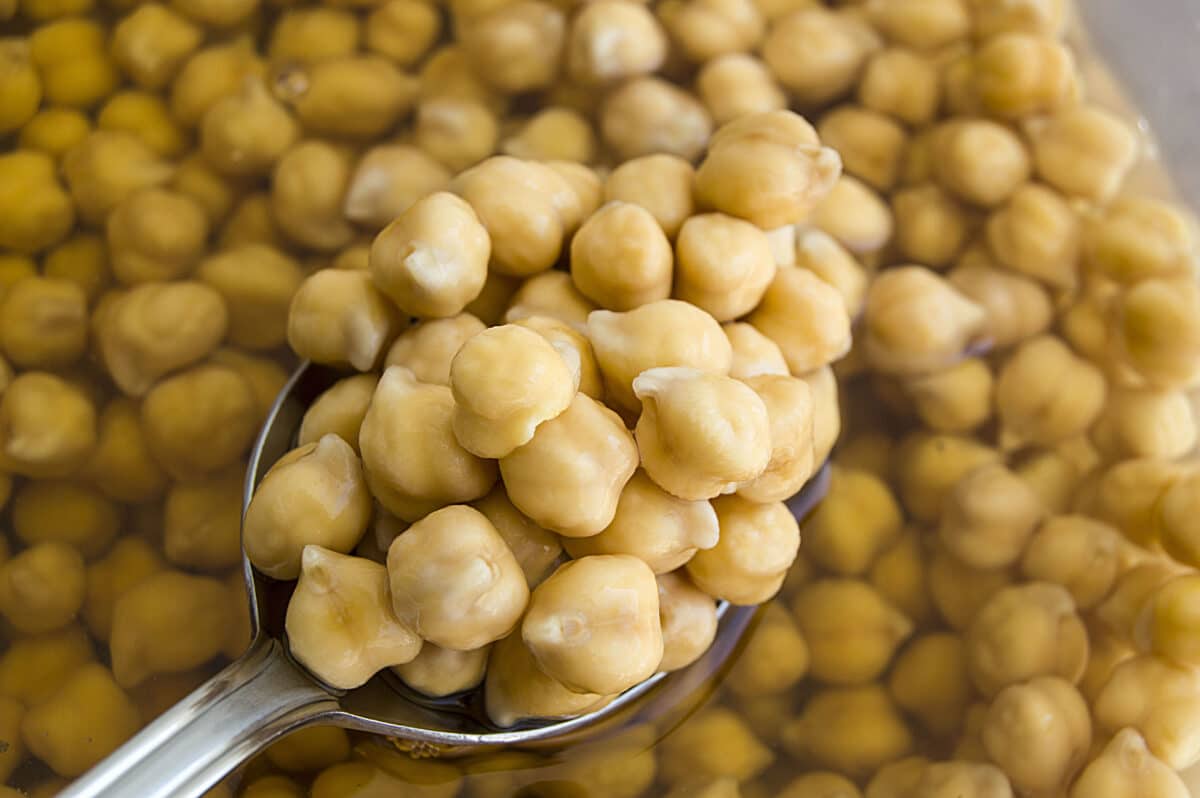 Pot of boiled chickpeas with spoon