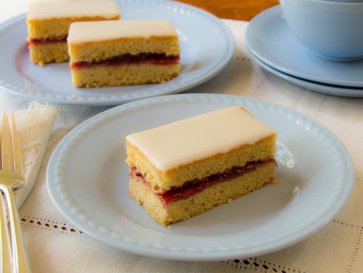 Detailed view of an Alexander cake slice on a white plate.