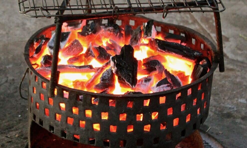 An mbaula over a circle of fire. A hearth in various forms has provided the principal focal point of a human home.