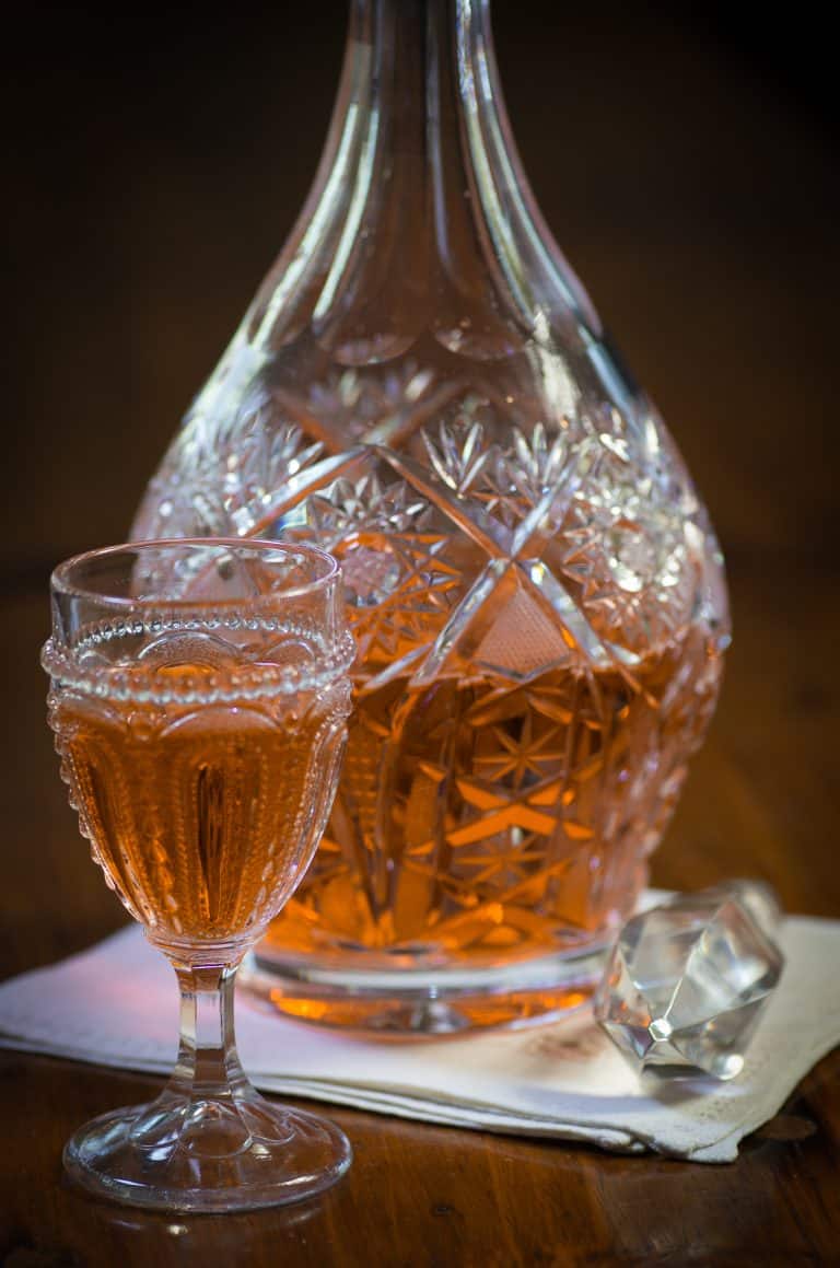Crystal decanter and glass filled with Arancello.