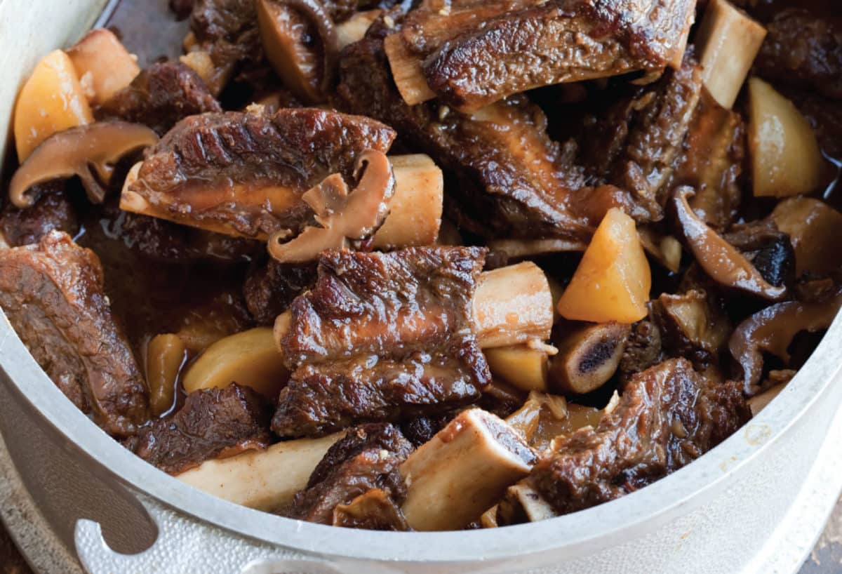 Gluten-free Asian braised short ribs with mushrooms and onions.