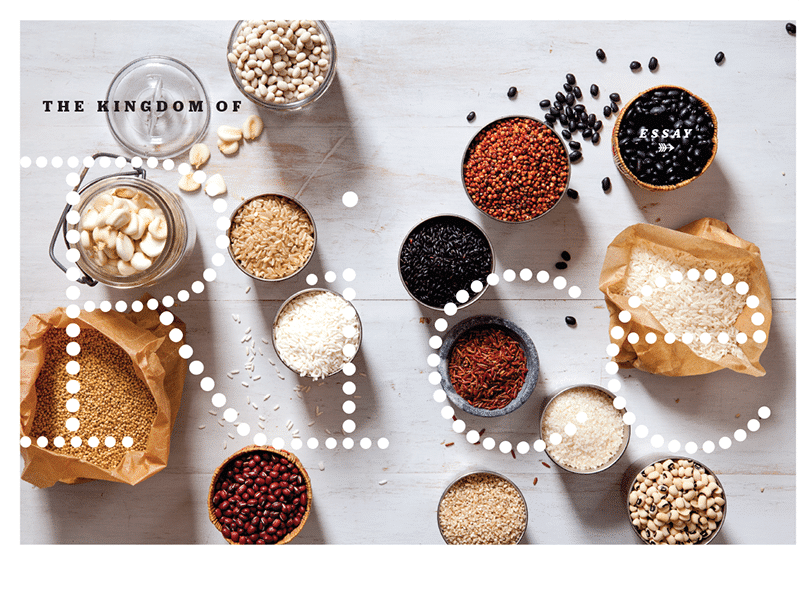 Various grains and spices neatly displayed on a white surface.
