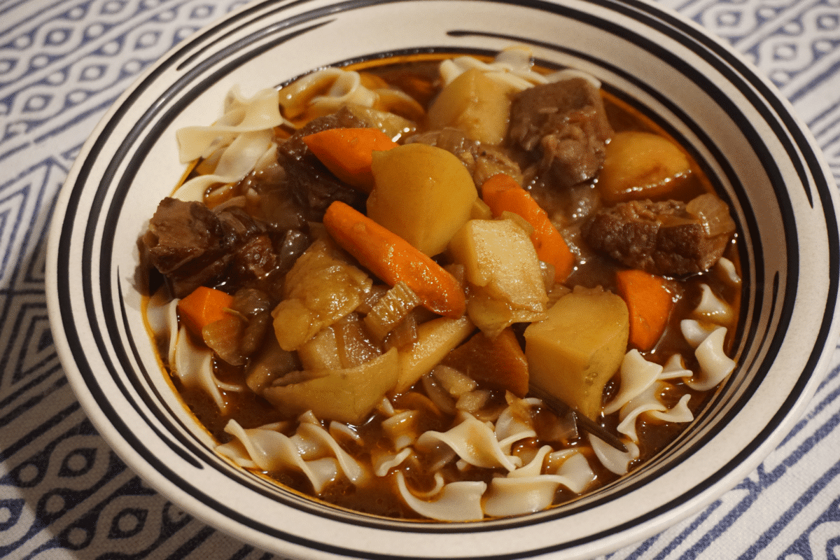Delicious beef stew with gem-cut vegetables in a bowl.