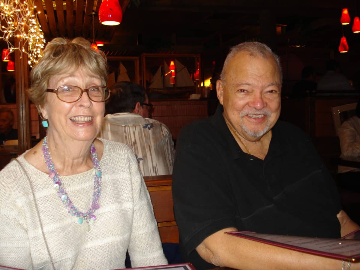 Betty and Bill Tillar smiling in a cozy restaurant setting.