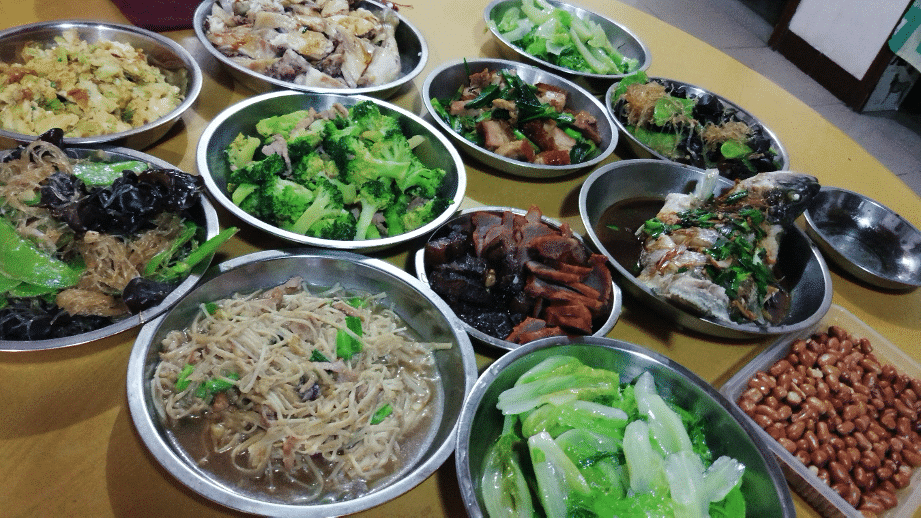 Cantonese family dinner spread from Guangdong, Foshan with vegetables and meat.