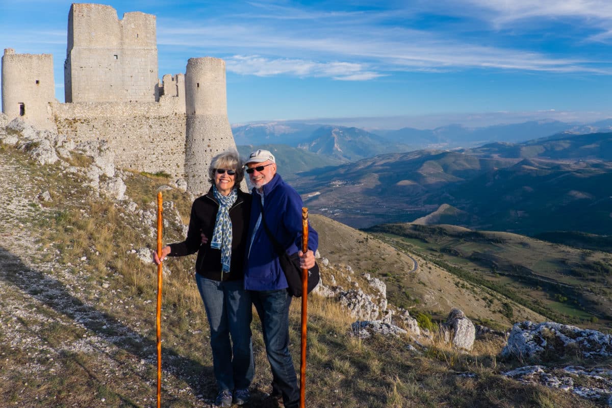 Author and husband posing at the Medieval Castle of Rocca Calascio in Italy. Photo by Domenica Marchetti