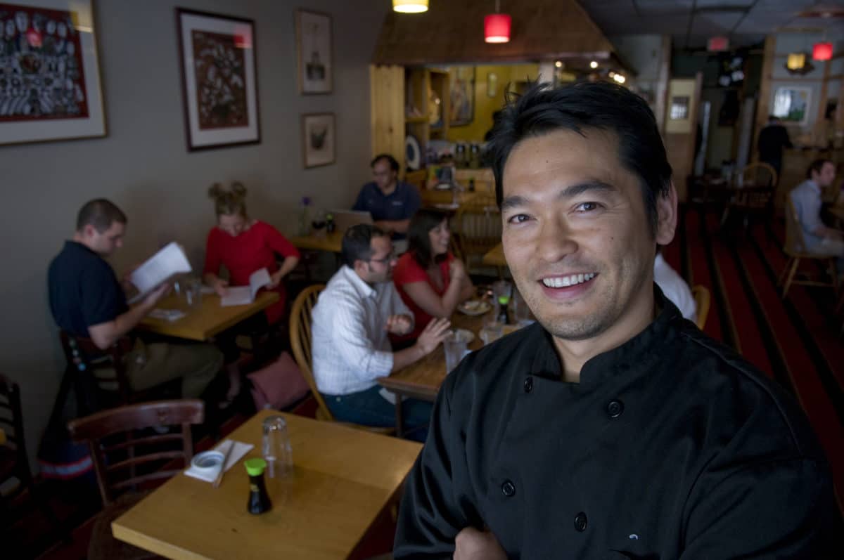Chef Bun Lai standing inside Miya's Restaurant in New Haven CT, USA, where he is owner and chef