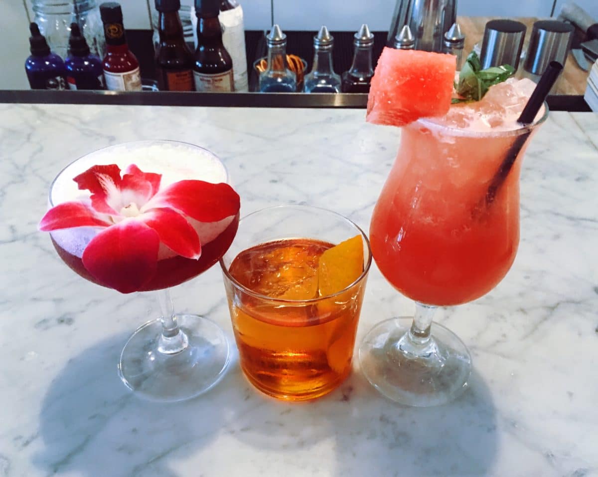 Close-up of a cocktail glass with details from a menu.