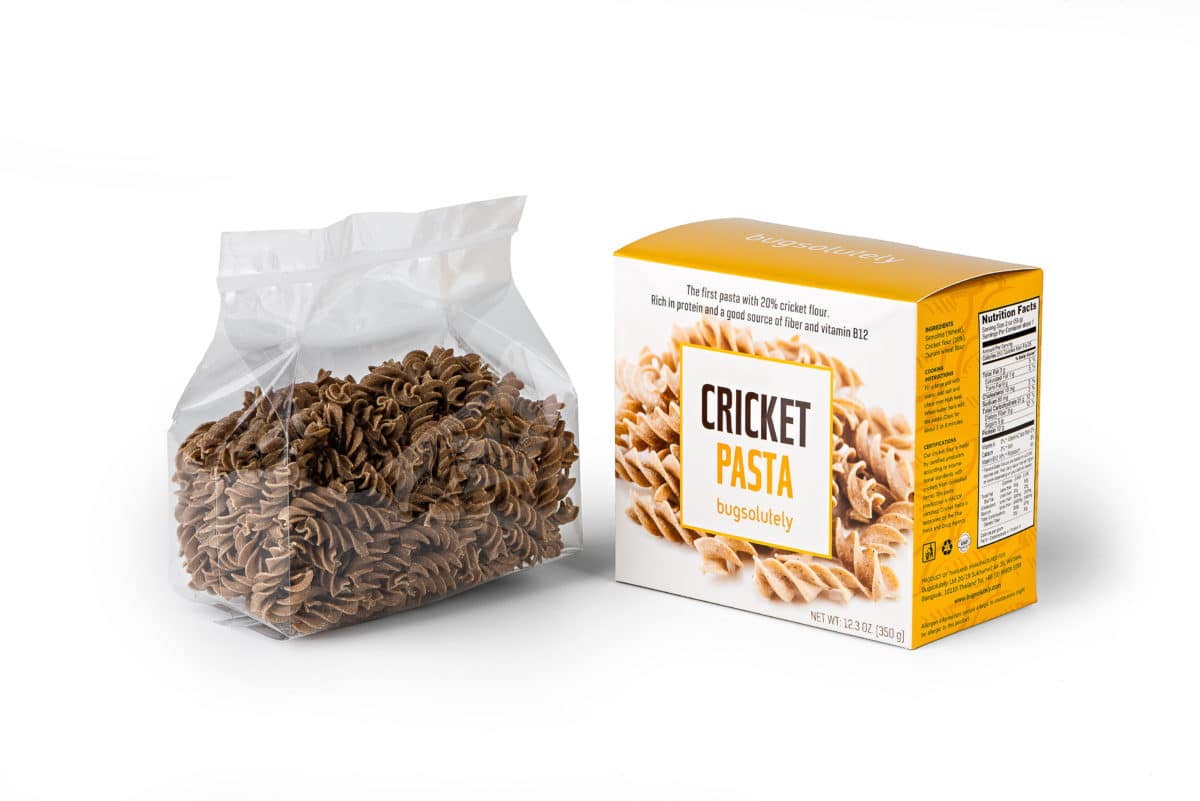 A packaged box and clear bag showcasing cricket-based pasta.