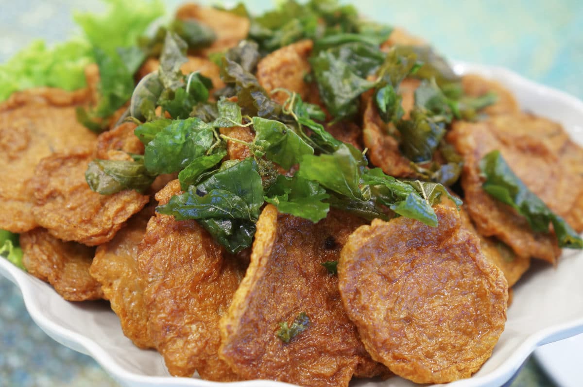 Deep-fried curried fish patties garnished with greens