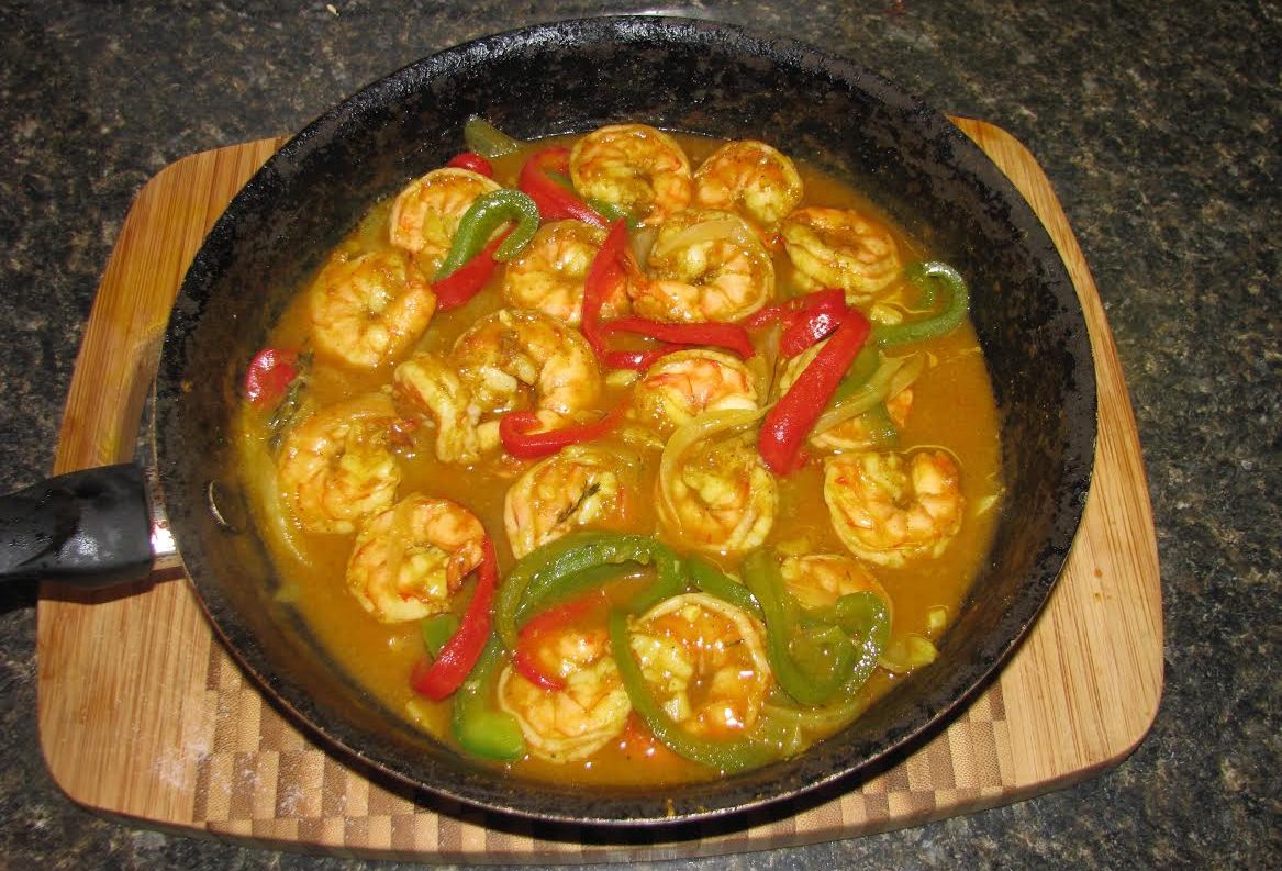 A sizzling dish of Caribbean Shrimp Curry.