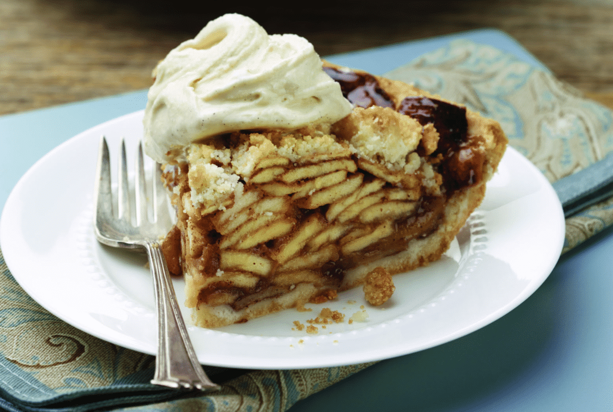 Slice of Dutch Apple-Caramel Pie with a scoop of ice cream