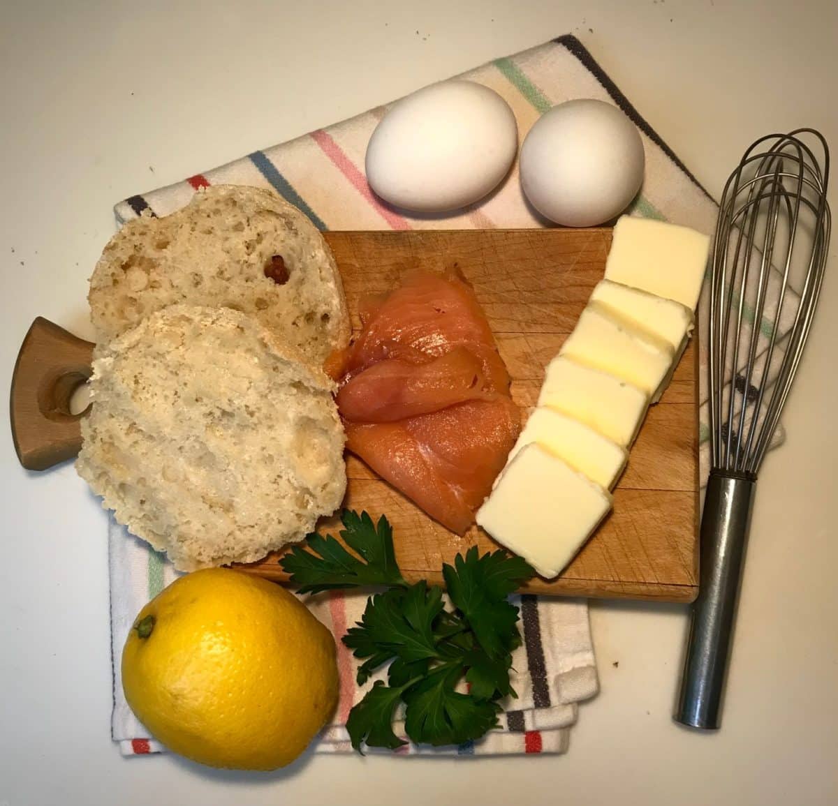 Ingredients like eggs, salmon, and butter for making Eggs Royale
