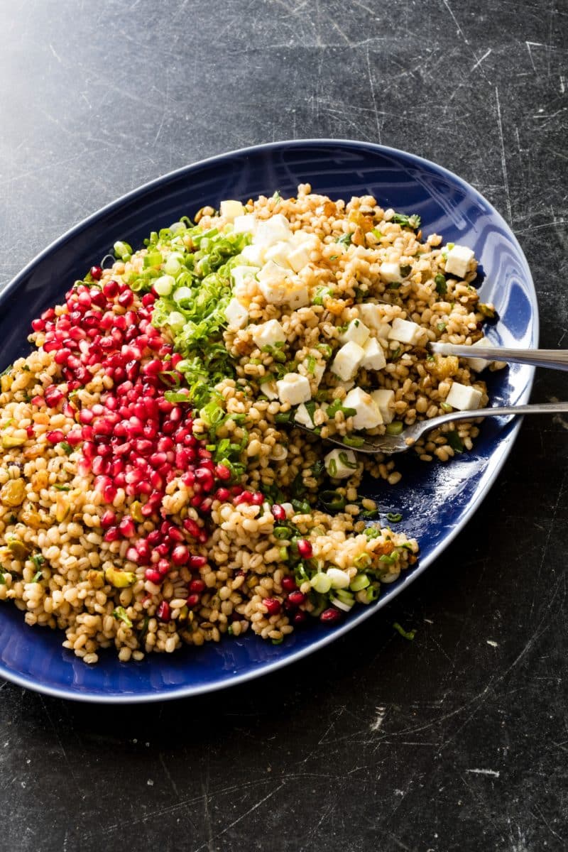 Egyptian barley salad garnished with fresh herbs and ingredients