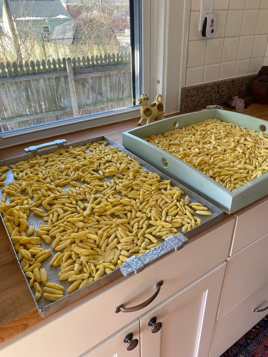 Homemade cavatelli pasta spread out for drying.