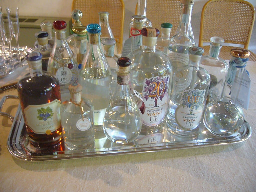Assorted grappa bottles on a silver tray