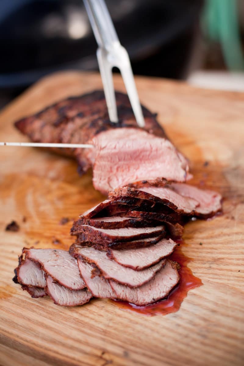 Slices of Grilled Tri-Tip with a 2-tine fork