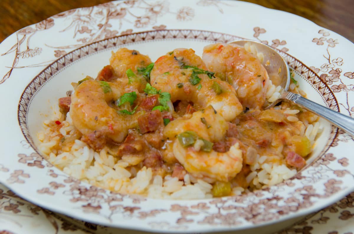 Creamy gulf shrimp gumbo served over rice in a porcelain dish