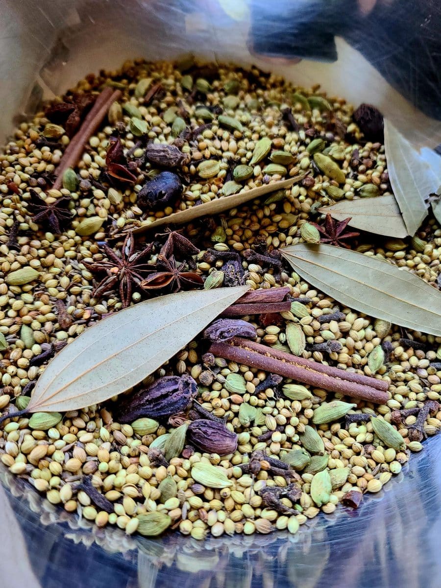Close-up of homemade Garam Masala spices and ingredients.