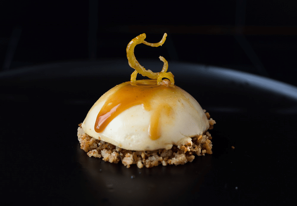 Honey semifreddo dessert with lemon caramel and hazelnut.