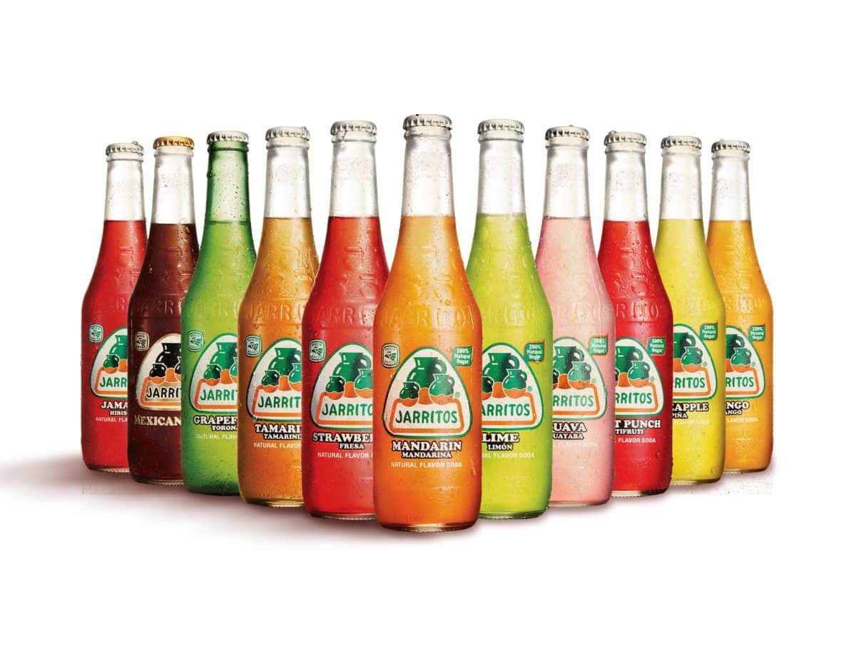Lineup of colorful Jarritos soda bottles