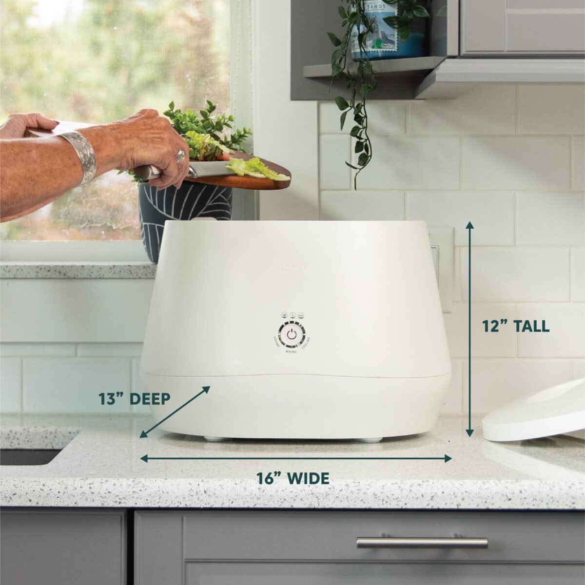 Close-up of Lomi electric composter on a kitchen countertop.
