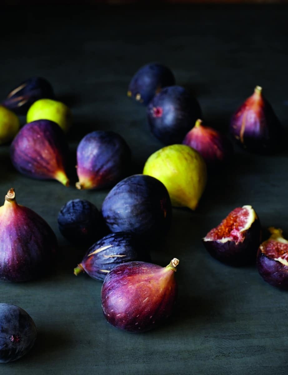 Fresh figs on a dark surface