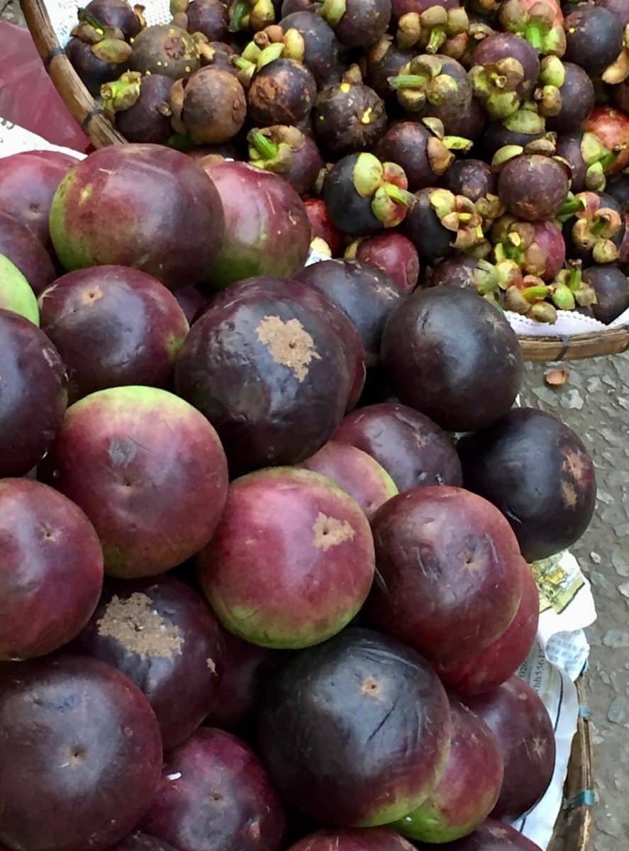 Pile of mangosteens displayed in a market