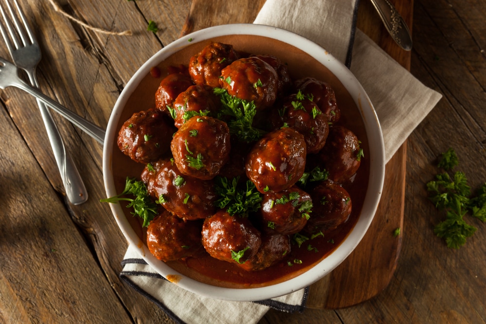 Mexican-inspired meatballs served with parsley in a bowl.