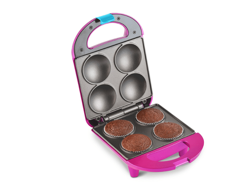 A pink Minnie Mouse themed cupcake maker with cupcakes inside.
