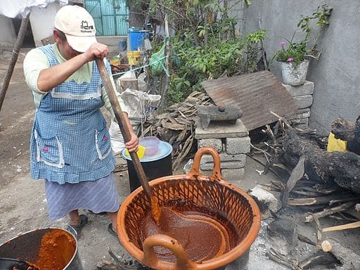 Woman preparing traditional mole poblano