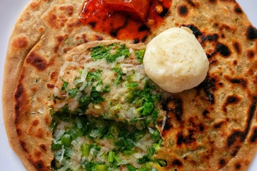 Stuffed Punjabi radish flatbread served with a dollop of white butter.