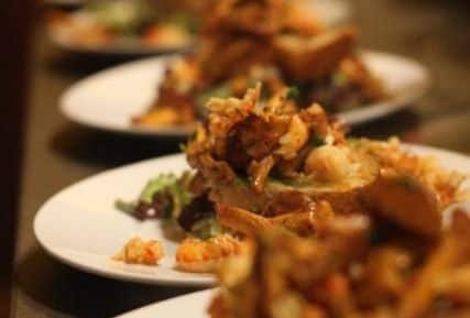 A plated dish with various food items, credit to Philippa Davis.