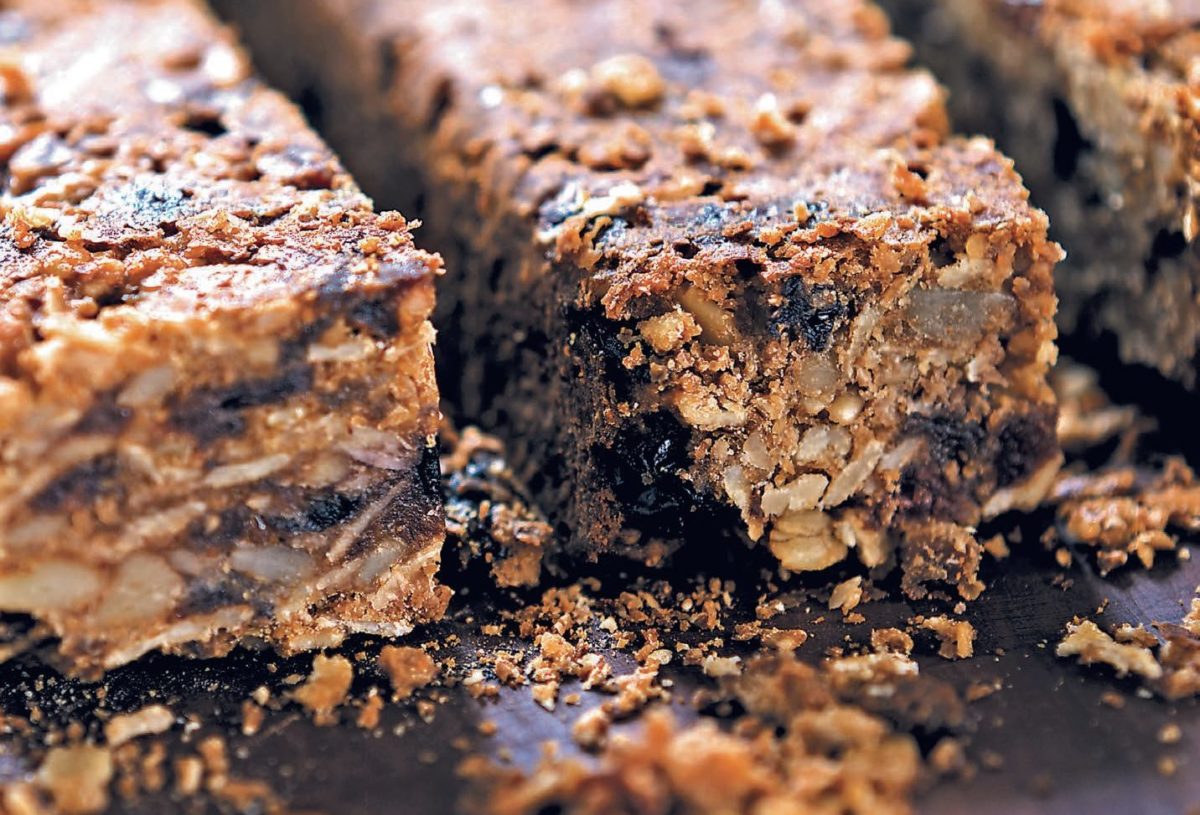 Stack of nut-filled chocolate bars with a rich and textured appearance.