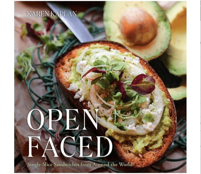 Cover of the book "Open Faced" featuring an avocado toast dish.