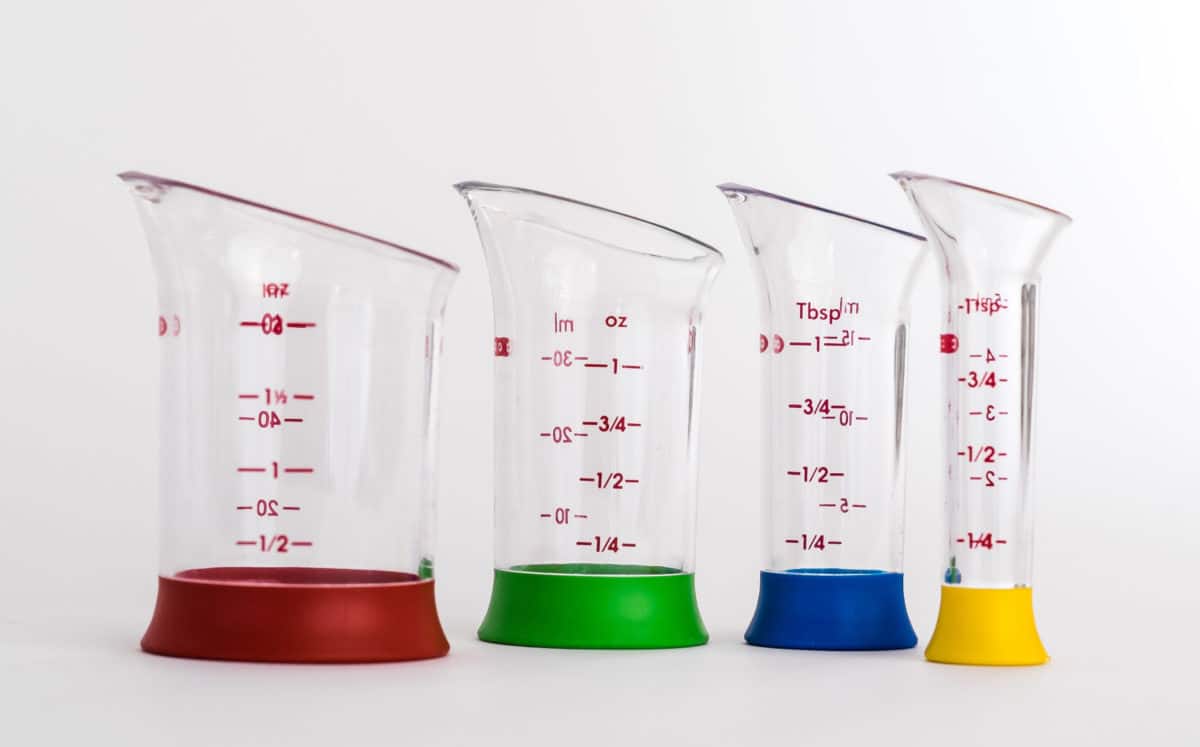 Set of four colorful Oxo measuring beakers with different measurement scales