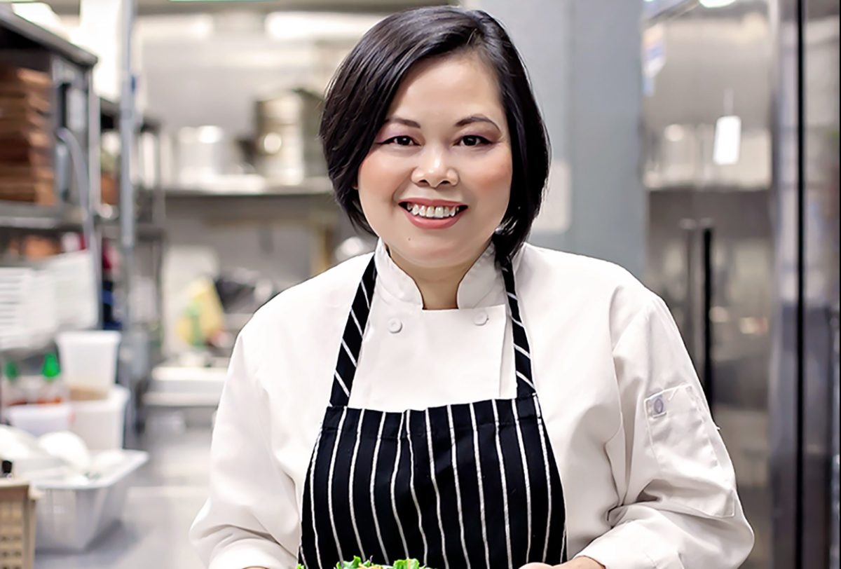 Close-up portrait of Chef Seng Luangrath in chef attire