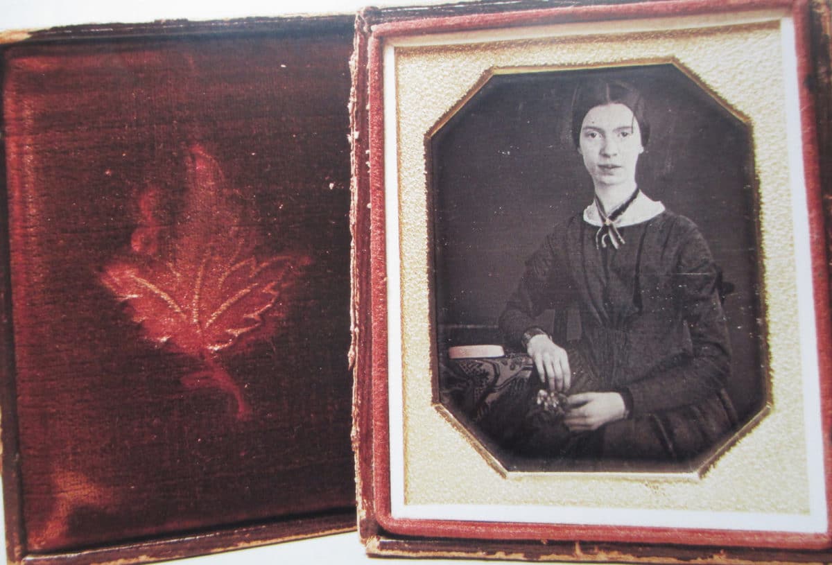 Black and white portrait photograph of Emily Dickinson.