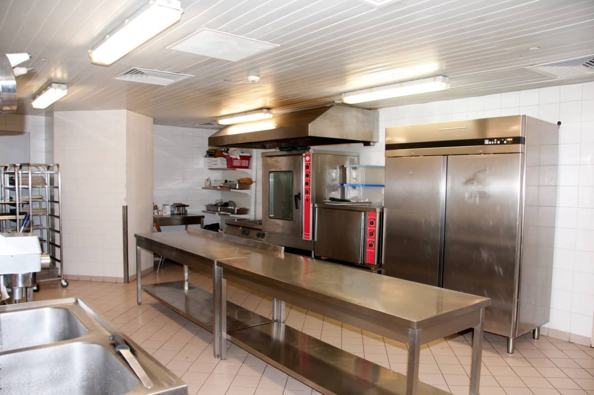 Stainless steel kitchen setup in a commercial environment