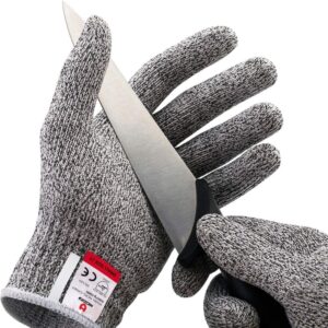 Hand wearing a no-cut protective glove with a knife