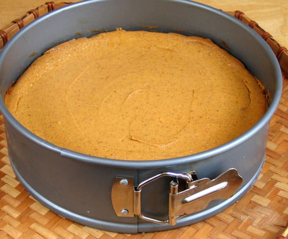 A pumpkin cheesecake in a springform pan.