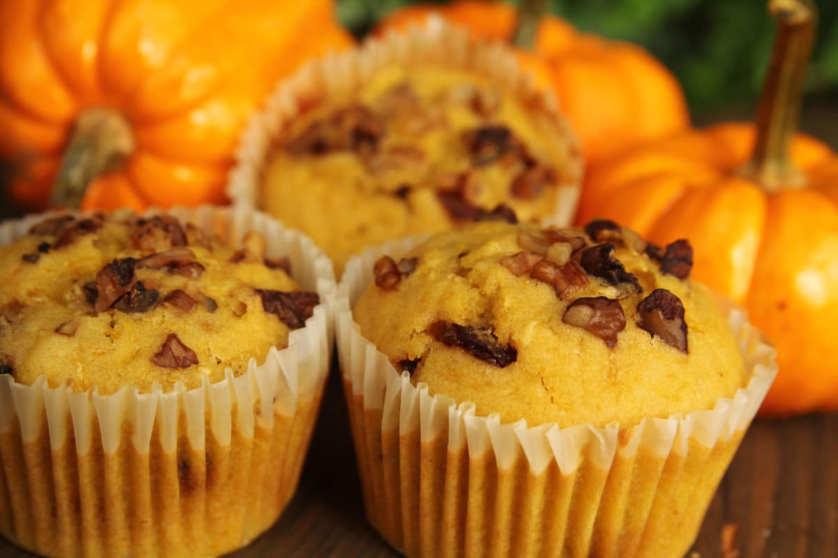 Freshly baked pumpkin muffins with walnuts and pumpkins