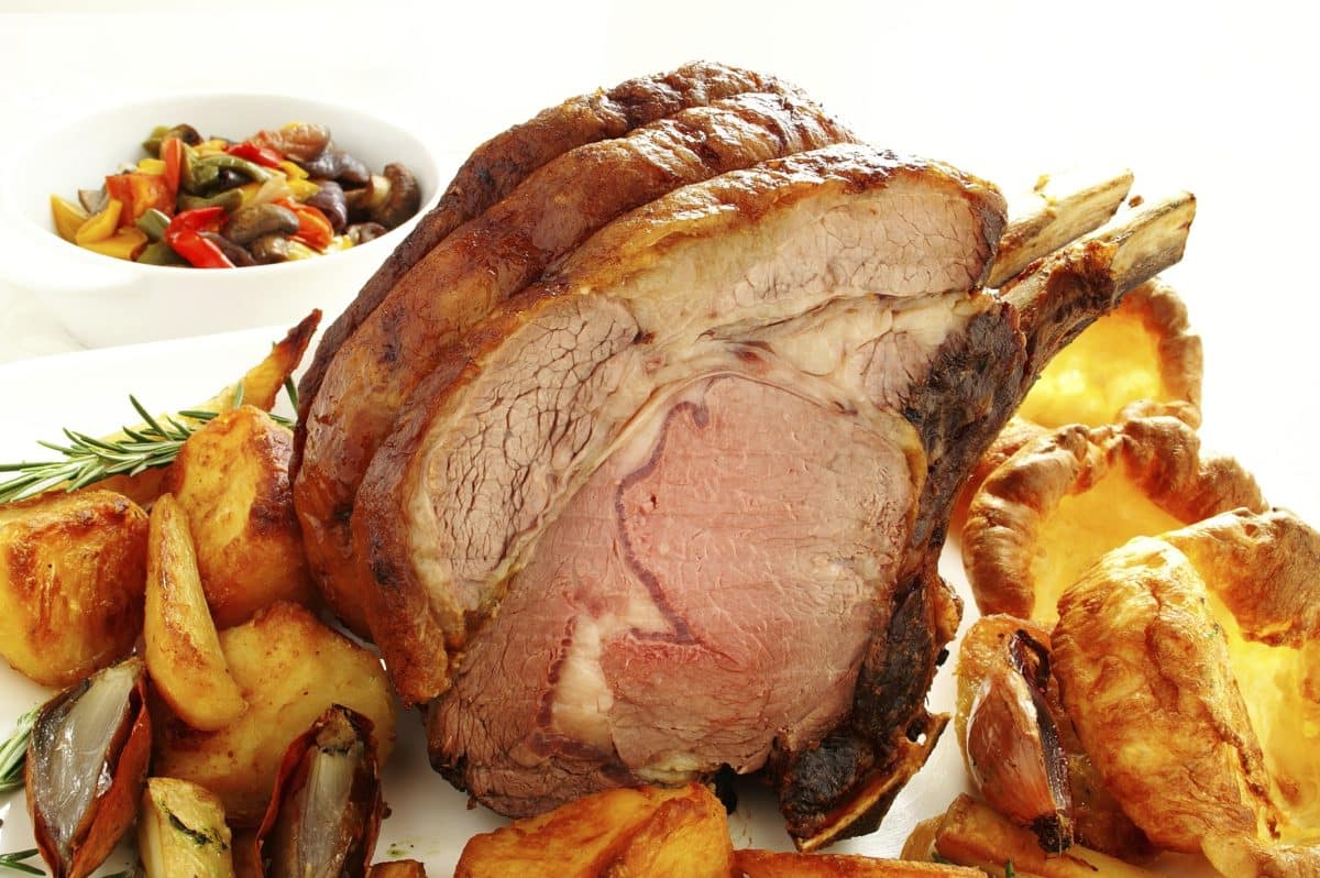A succulent roast rib of beef paired with golden Yorkshire Pudding.