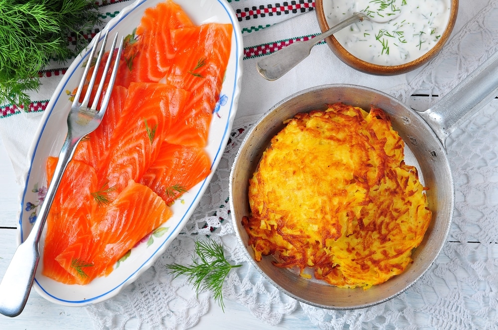 Traditional Pankukas dish with thinly sliced salmon and dill cream