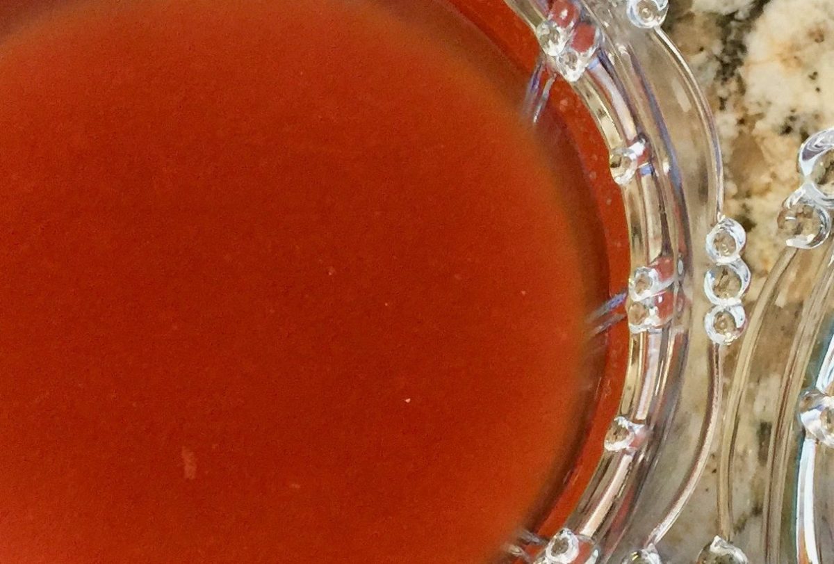 Glass bowl filled with vibrant salsa casera