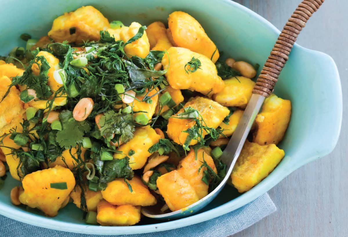Gluten-free Asian sautéed catfish served in an aqua bowl.