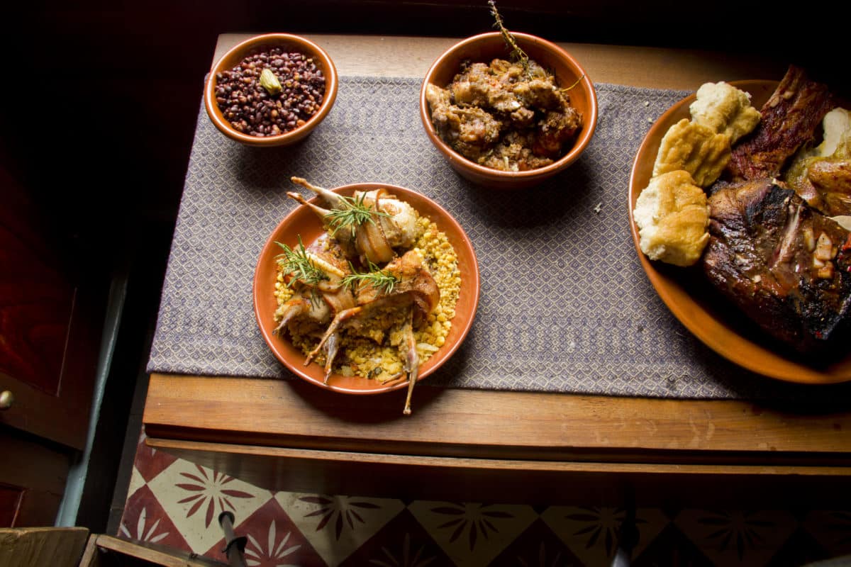 Traditional Crowder Peas dish served in clay bowls on a rustic sideboard.