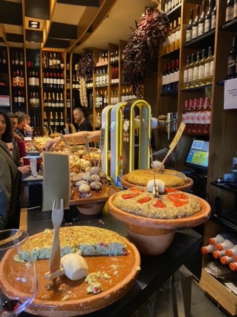 Interior of a Spanish deli with wines and assorted products.