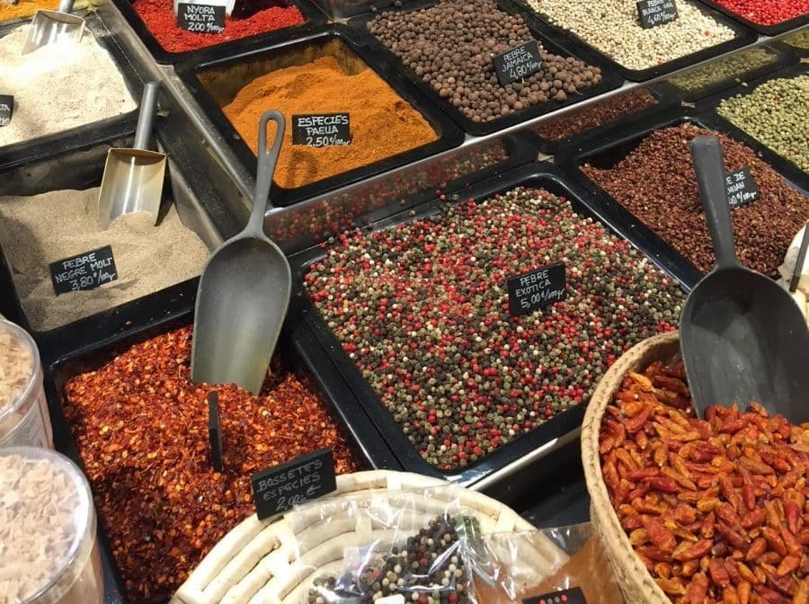 Assortment of spices displayed at a market in Spain.