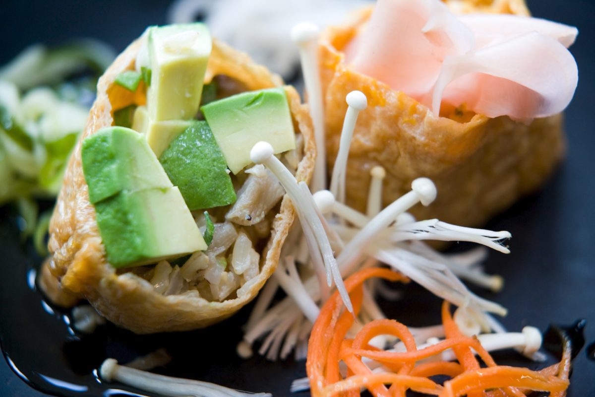 Sweet tofu pockets filled with avocado, shredded chicken, and pickled ginger.